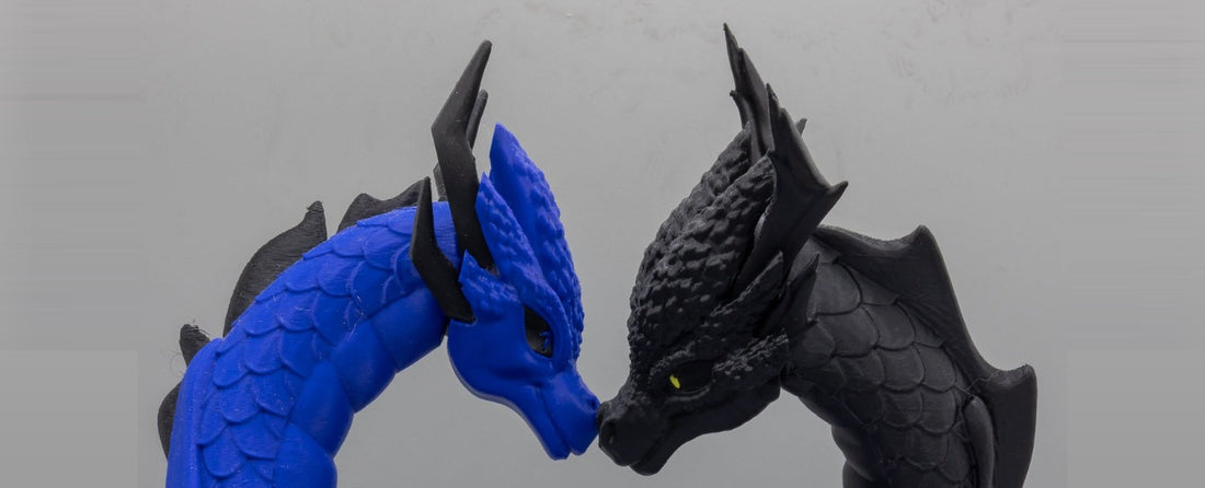 Draconic Bond 3D-printed bonded dragon pair — sapphire blue and midnight black dragon heads meeting nose to nose, centered