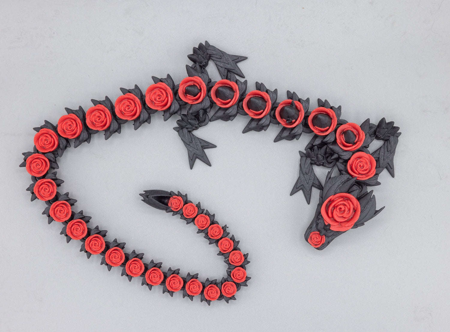 Rose Dragon articulated 3D-printed figurine by MacPack3D