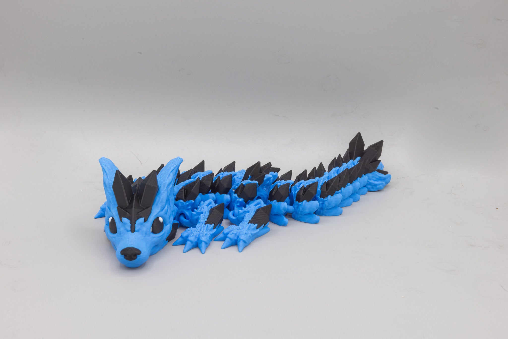 Baby crystal wolf dragon articulated fantasy creature 3D printed in blue PLA