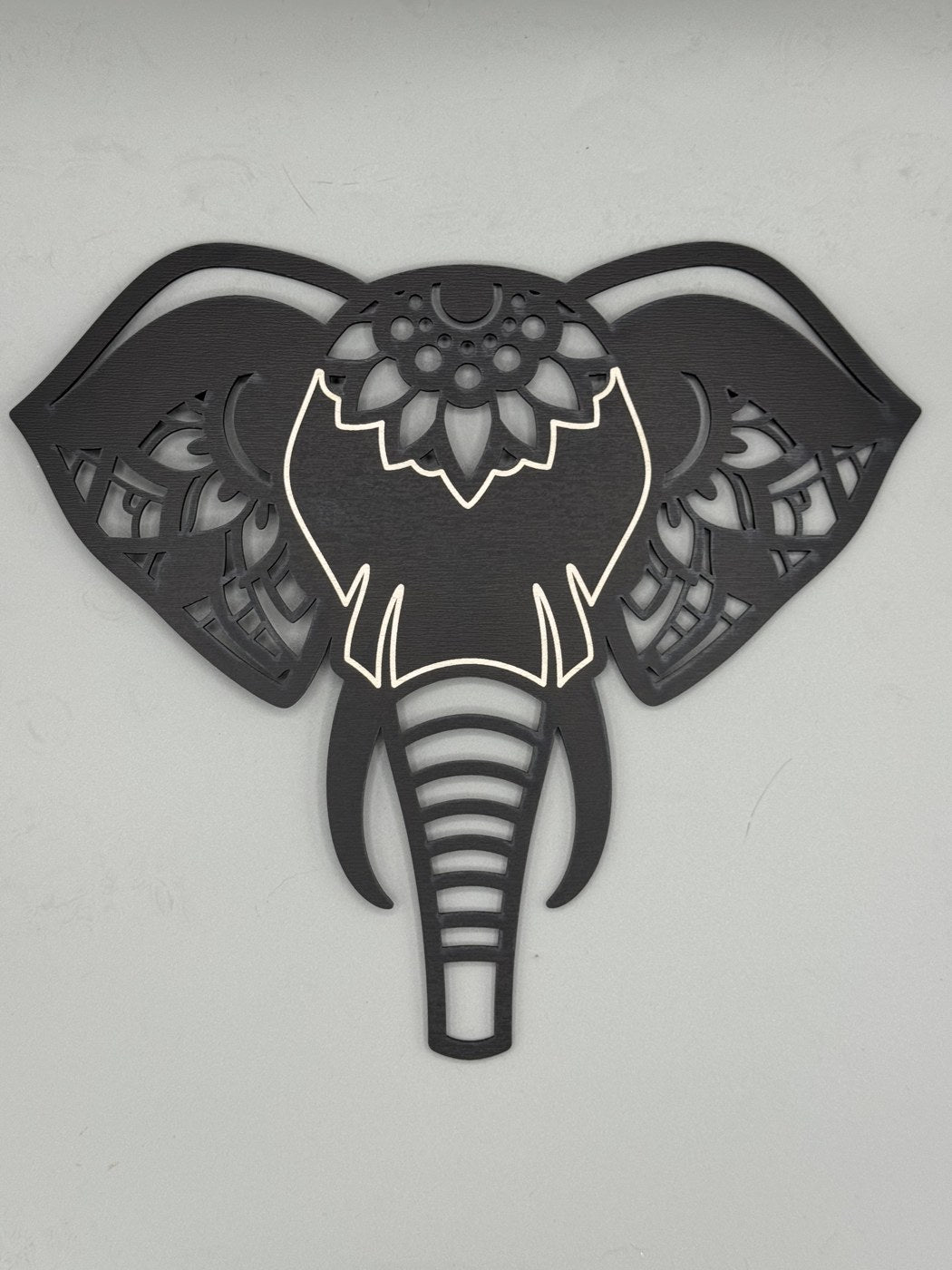 Front-facing laser-cut wood elephant head wall art by MacPack3D