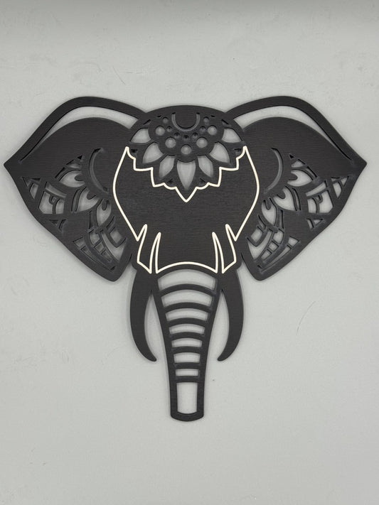 Front-facing laser-cut wood elephant head wall art by MacPack3D